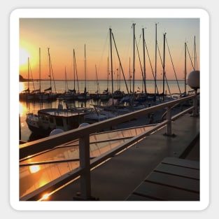 Peaceful sunset over marina with sailboat mast on Baltic sea in Langballig yachting harbor, Schleswig- Flensburg, Germany Sticker